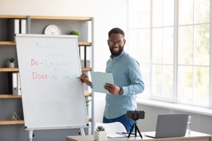 Happy young black man teacher in glasses looks at 2022 10 07 01 48 12 utc