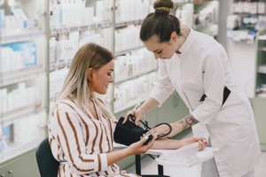 Trainee taking blood pressure of his customer in t 2022 02 01 22 39 32 utc