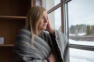 Woman contemplating at window in winter 2022 10 31 23 35 39 utc