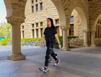 Ava Lakmazaheri, a graduate student in the Biomechatronics Laboratory, walking while wearing the untethered exoskeleton. (CREDIT: Kurt Hickman)