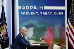 President Joe Biden speaks with researchers and patients about ARPA-H, a new health research agency that seeks to accelerate progress on curing cancer and other health innovations, on March 18 in the South Court Auditorium on the White House campus in Washington. (Patrick Semansky/AP)