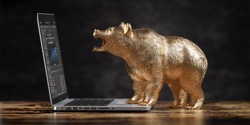Bear and laptop with stock exchange chart on the s 2022 03 22 15 46 42 utc