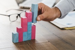 Businessman building a successful financial graph 2021 08 26 22 39 46 utc  1