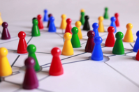 Close Up Photography of Yellow Green Red and Brown Plastic Cones on White Lined Surface Free Stock Photo