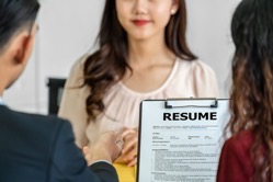 Closeup resume in two manager hand holding when di 2021 09 01 23 17 13 utc