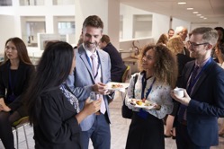 Delegates networking during conference lunch break 2021 08 26 16 12 54 utc