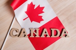 Flag of canada the word canada in wooden abstract 2022 02 04 04 40 49 utc