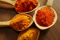 Four Assorted Spices On Wooden Spoons Free Stock Photo