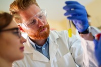 Group of medical scientists working at laboratory 8JFHENS
