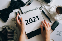 Hands Holding a 2021 Calendar Free Stock Photo