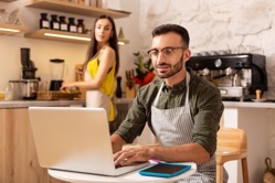 Husband working on laptop while owning family busi 2022 02 02 21 46 50 utc