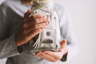 Kid saves money put money in a piggy bank 2021 10 31 01 26 02 utc