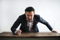 Mad formal executive man yelling at camera Free Stock Photo