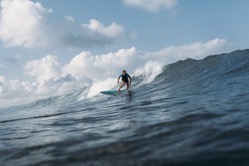 Male surfer riding wave on surf board in ocean 2022 01 18 23 58 27 utc