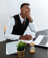 Man in Black Vest and White Dress Shirt Sitting on Chair Free Stock Photo
