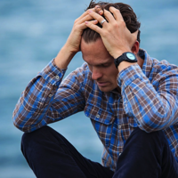 Man in Blue and Brown Plaid Dress Shirt Touching His Hair Free Stock Photo