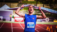 Man Ripping Finish Line Strap Free Stock Photo