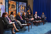 Panel of people on the stage.
