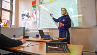 A teacher writes on a whiteboard to explain William Shakespeare’s Romeo and Juliet during an English lesson. Now AI could help trainee teachers identify struggling students, say researchers (Ben Birchall/PA)