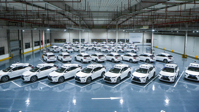 Warehouse full of cars.