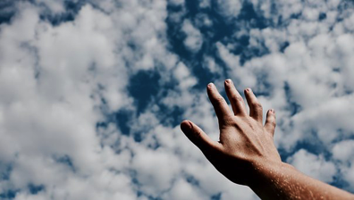 hand in clouds