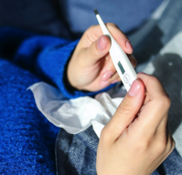 Person Holding Thermometer Free Stock Photo