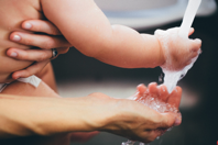 Person Holding Water Free Stock Photo