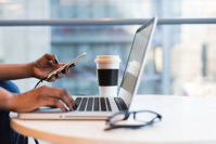 Person Using Macbook Air on Table Free Stock Photo