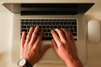 Person Using Macbook Pro With Apple Magic Mouse Free Stock Photo
