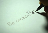 Creative with a pencil drawing a picture.
