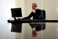 Entrepreneur sitting at a desk.