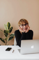 Entrepreneur - Woman sitting behind a laptop.