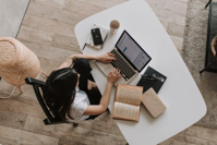 Person at desk working on laptop