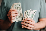 money.. person holding money.
