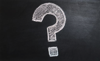 Question mark drawn on white board.