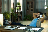 Relaxed businessman sitting with feet on table 2021 09 24 03 11 16 utc