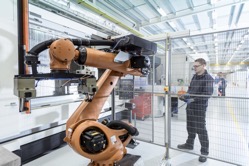 Robotics engineer operating robot aided cnc machin 2022 03 04 01 43 21 utc