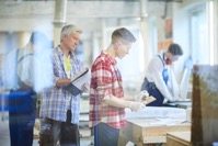 Serious foreman controlling young worker 2021 09 24 03 01 13 utc