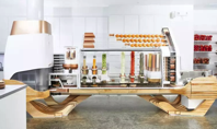 This crazy looking robot is the chef at a new burger joint