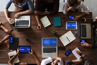 Top View Photo Of People Near Wooden Table Free Stock Photo