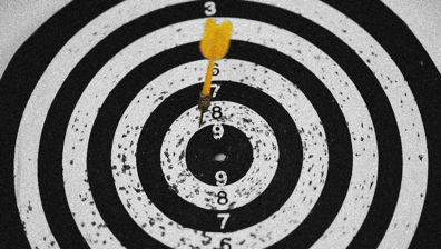 Dartboard with dart in the 8 ring.