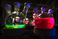 Life sciences... people looking into an experiment