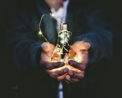 person holding light bulb