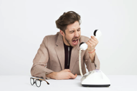 Man holding telephone screaming photo Free Phone call Image on Unsplash