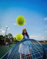 tennis... person with racket and two tennis balls