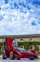 wealthy - sports car in front of mansion