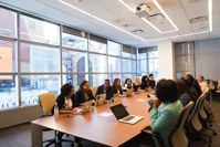 people meeting around the boardroom table.