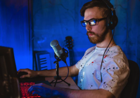 Man with mic and computer.