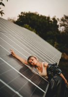 solar panels with woman lying on them.