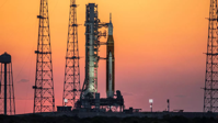 The sunrise casts a warm glow around the Artemis I Space Launch System (SLS) and Orion spacecraft at Launch Pad 39B at NASA’s Kennedy Space Center in Florida on March 21. (Image credit: NASA/Ben Smegelsky)